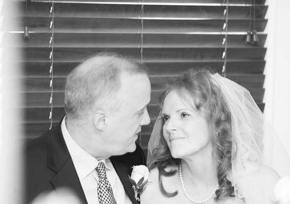 Former Virginia single looking lovingly into eyes of her husband