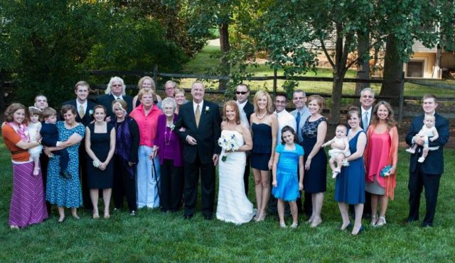 Huge family photo on grass at wedding