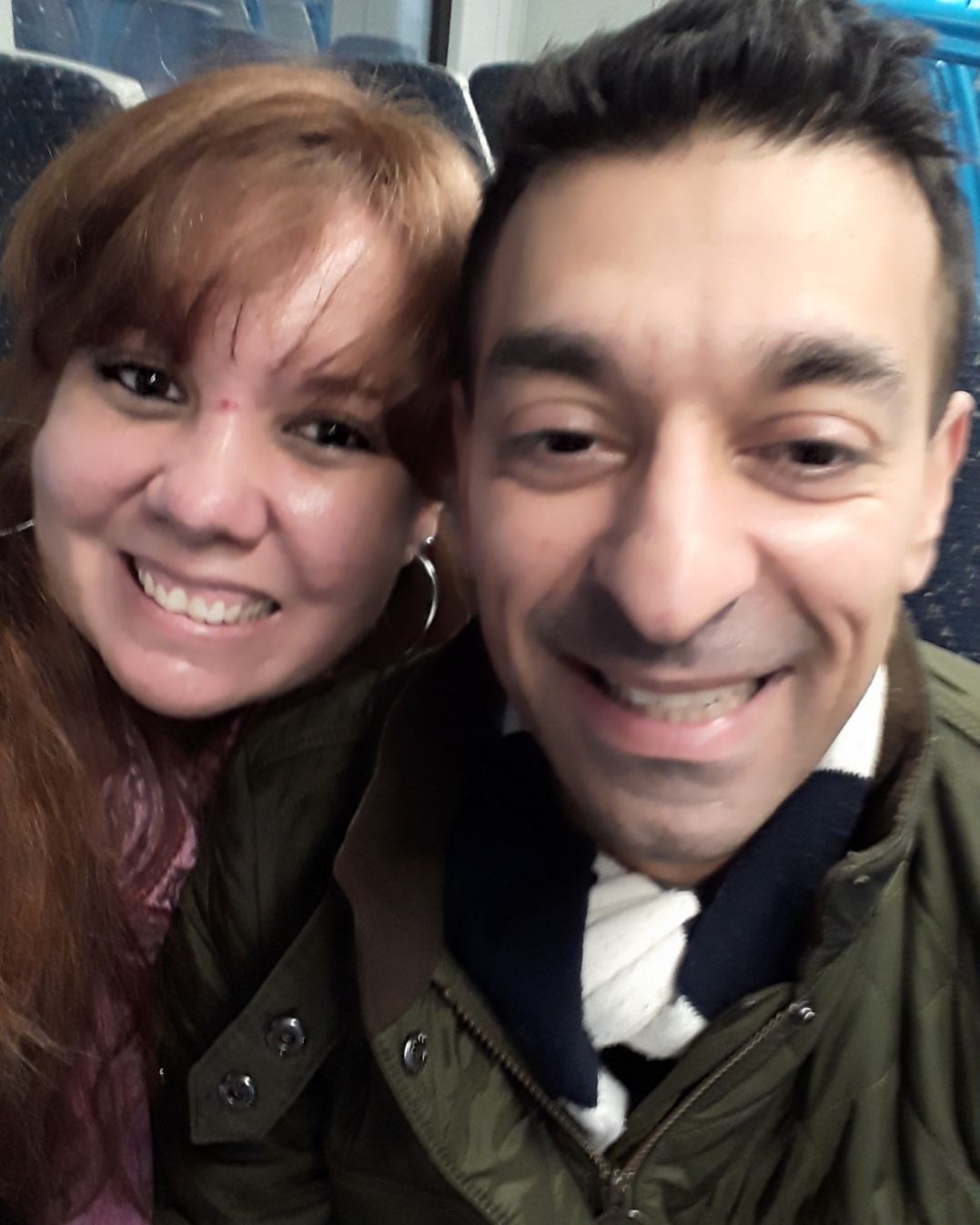 Christian singles laughing together on the London Underground
